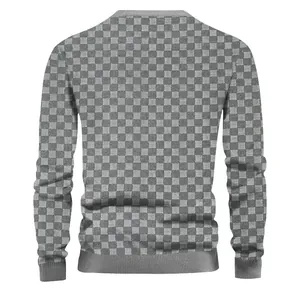 Back view of a men's heavy jacquard checkerboard sweater with grey knit texture.