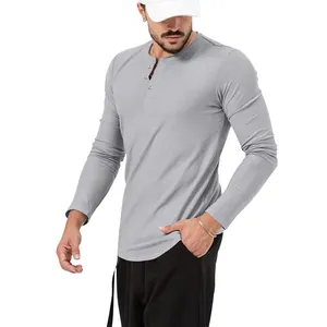 Macro view of men's slim fit long-sleeve grey Henley shirt with button details