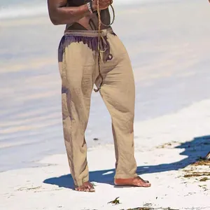 Detailed view of breathable cotton linen men's loose casual trousers in beach setting