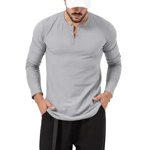 Detail view of a grey men's long sleeve slim fit Henley t-shirt with buttoned collar.