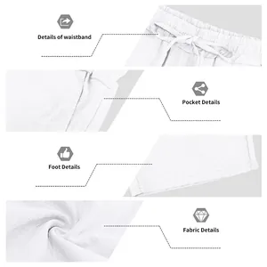 Close-up details of white linen beach shorts featuring waistband and fabric texture.