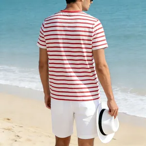 Detailed back view of casual men's red and white striped summer t-shirt at the beach
