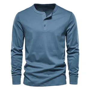 Detailed front view of a slim fit men's long-sleeve Henley shirt in dusty blue