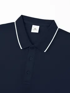 Detail of navy blue quick-dry polo shirt collar with white trim and size XL label.