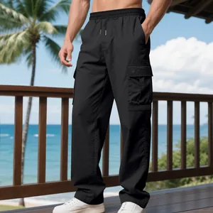 Detailed view of men's black quick-dry cargo pants with a side pocket on a balcony