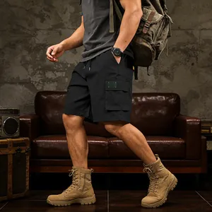 Close-up of black cargo shorts with side pockets and drawstring waist for men