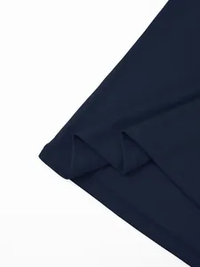 Close-up detail of navy blue quick-dry polo shirt hem showing breathable mesh fabric texture