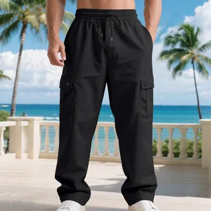 Detailed close-up of men's black quick-dry cargo pants featuring large side flap pockets