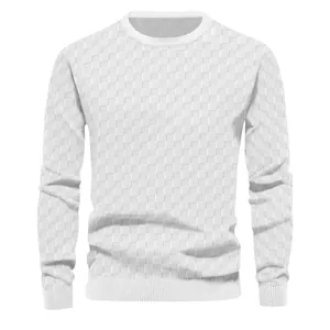 Detail view of the heavy jacquard checkerboard pattern on a white men's knitted sweater