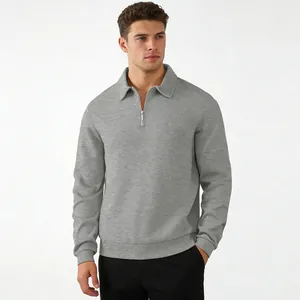 Men's grey quarter-zip polo sweatshirt with textured jacquard pattern for autumn.