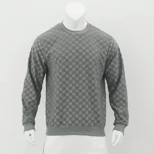 Detailed macro view of the grey heavy jacquard checkerboard pattern on men's knit sweater