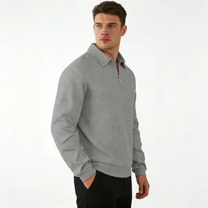 Side view of men's grey textured jacquard quarter-zip polo shirt with a lapel collar.