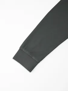 Detailed close-up view of the ribbed cuff on a dark grey quick-dry long-sleeved polo shirt