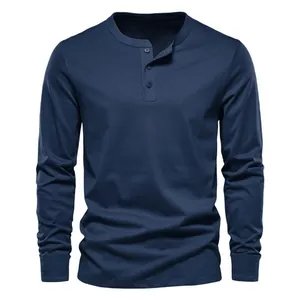 Detailed close-up showing the fabric texture and button collar of a navy blue Henley shirt