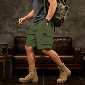 Close-up of men's army green cargo shorts with multi-pockets for outdoor activities