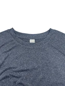 Close-up of the neckline and material tag on a blue quick-dry athletic sports t-shirt.