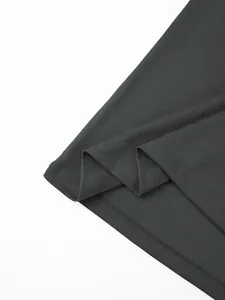 Close-up of the breathable mesh fabric and hem stitching on a grey men's polo shirt