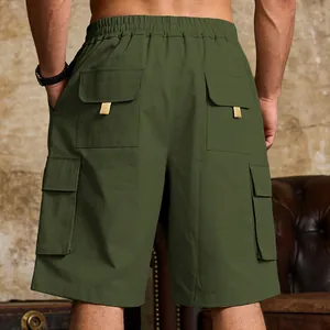 Rear view detail of men's olive green cargo shorts with functional flap pockets.