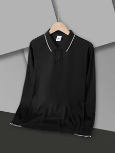 Macro detail of black long-sleeve polo shirt showing white tipped collar and button placket.