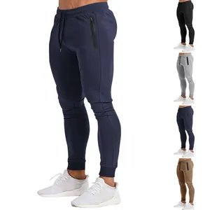 Close-up detail of men's athletic joggers with waterproof zipper pockets, navy.