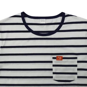 Detail of a striped men's T-shirt with a chest pocket and branded orange label.