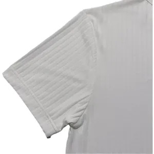 Close-up of white ribbed fabric detail on a men's short-sleeved Henley shirt.