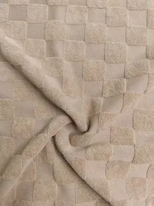 Detailed macro view of high-quality jacquard checkerboard knitted fabric texture