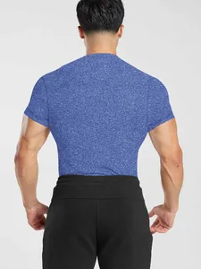 Rear view of a blue heathered men's quick-dry athletic T-shirt on a fit model