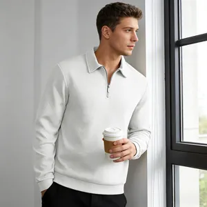 Close-up detail of white textured long-sleeve polo shirt featuring jacquard pattern