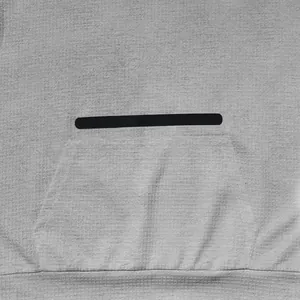 Detailed macro view of the waffle knit fabric on the men's casual hooded t-shirt.