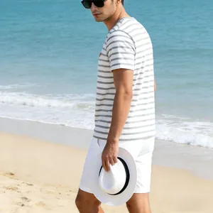 Men's casual striped pocket T-shirt shown in a scenic beach seaside vacation setting