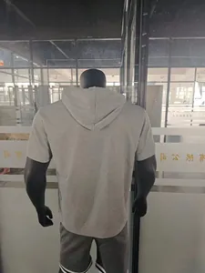 Detailed back view of a gray men's short sleeve hoodie in heavy textured casual fabric