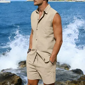 Men's beige linen sleeveless shirt and shorts set displayed in a coastal beach setting.