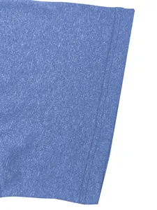Detailed macro view of blue heathered quick-dry fabric on men's sports T-shirt