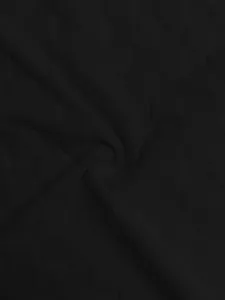 Macro close-up detail of black checkerboard jacquard knit fabric for heavy men's sweater