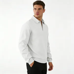 Close-up view of the detailed jacquard texture on white long sleeve men's polo sweatshirt