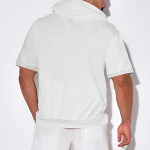 Macro view of the heavyweight waffle texture on the back of a white hooded t-shirt