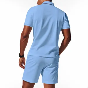 Back view of men's light blue waffle knit polo shirt and matching shorts set.