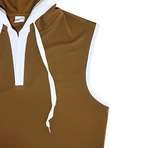 Detail of brown men's hooded tank top with white contrast trim and drawstring.
