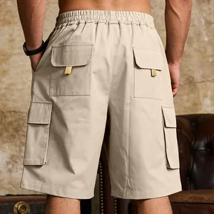 Back view detail of khaki cargo shorts with multiple flap pockets and elastic waist