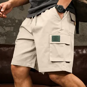 Detailed view of men's beige cargo shorts featuring a large side utility pocket