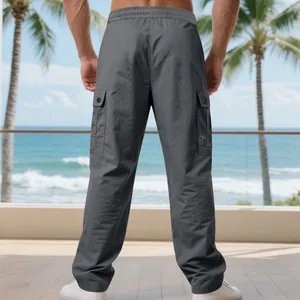Back view of men's grey quick-dry cargo pants featuring large side pockets and straight leg fit