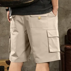 High-quality detailed view of back cargo pockets on men's khaki outdoor workwear shorts