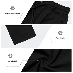 Gros plan d'un pantalon en lin noir pour homme montrant la taille, l'ourlet et le tissu.