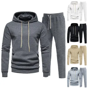 Detail of men's waffle textured hoodie and joggers set shown in various color versions