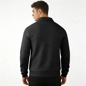 Back view showing the intricate textured jacquard pattern on black long sleeve polo