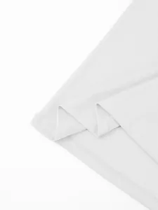 Close-up detail of white quick-dry fabric and double stitching on a men's polo shirt