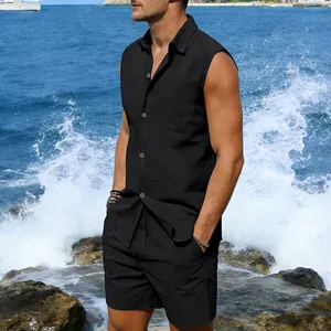 Close-up detail of a man wearing a black linen sleeveless beach set with crashing ocean waves