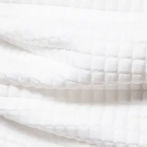 Close-up detail of premium white waffle knit fabric texture for men's casual tracksuit