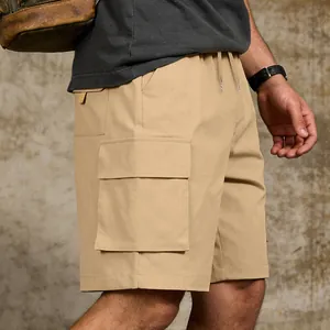 Close-up detail of khaki men's cargo shorts featuring a large side pocket and fabric texture